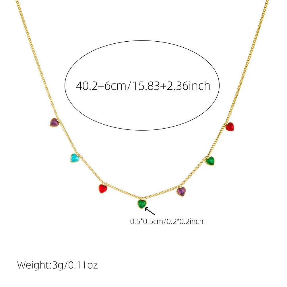 Gold-plated stainless steel heart necklace on a model, showing adjustable length.