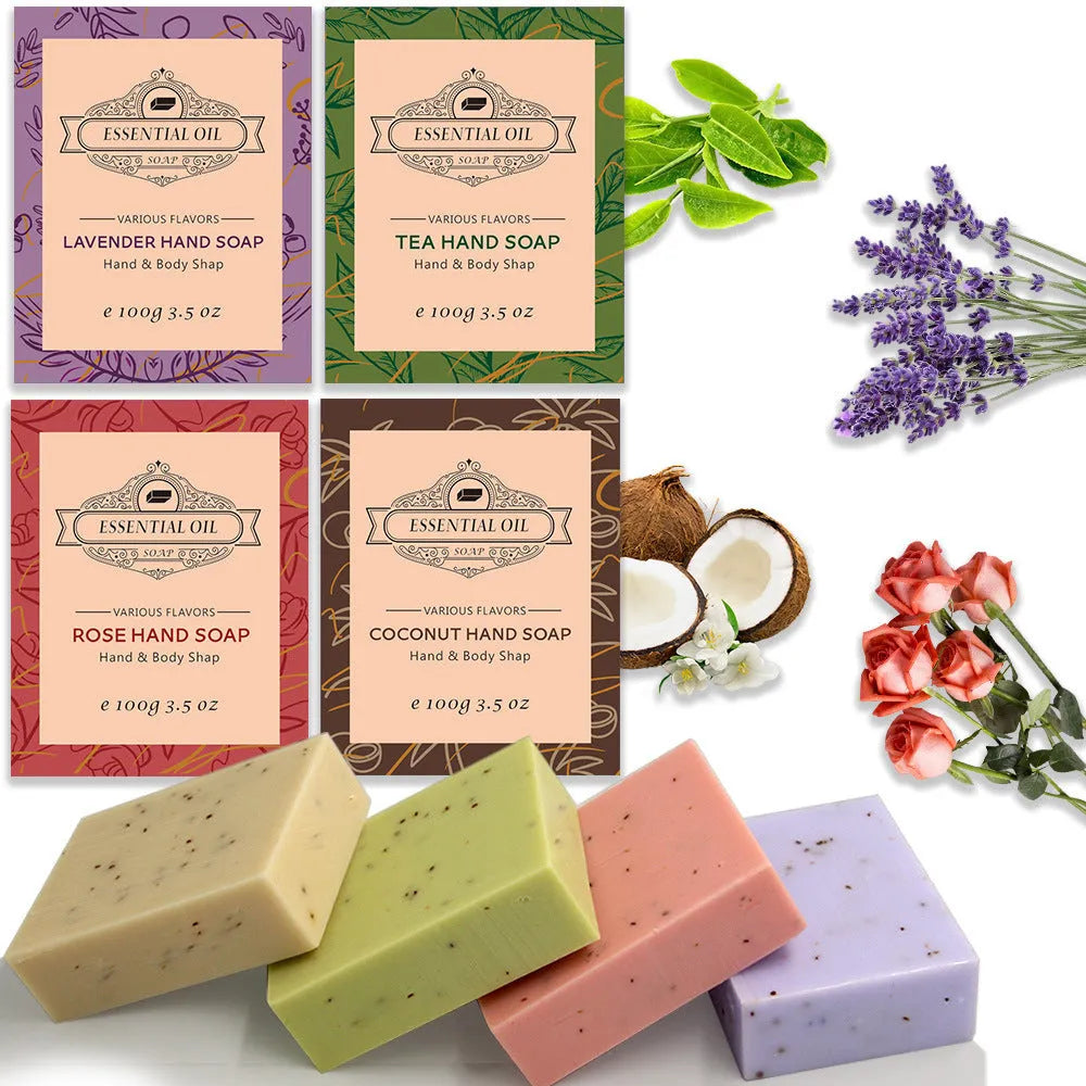 Frosted white handmade essential oil soap bar on a wooden dish with leaves, shown with Coconut, Green Tea, Lavender, and Rose variant labels.