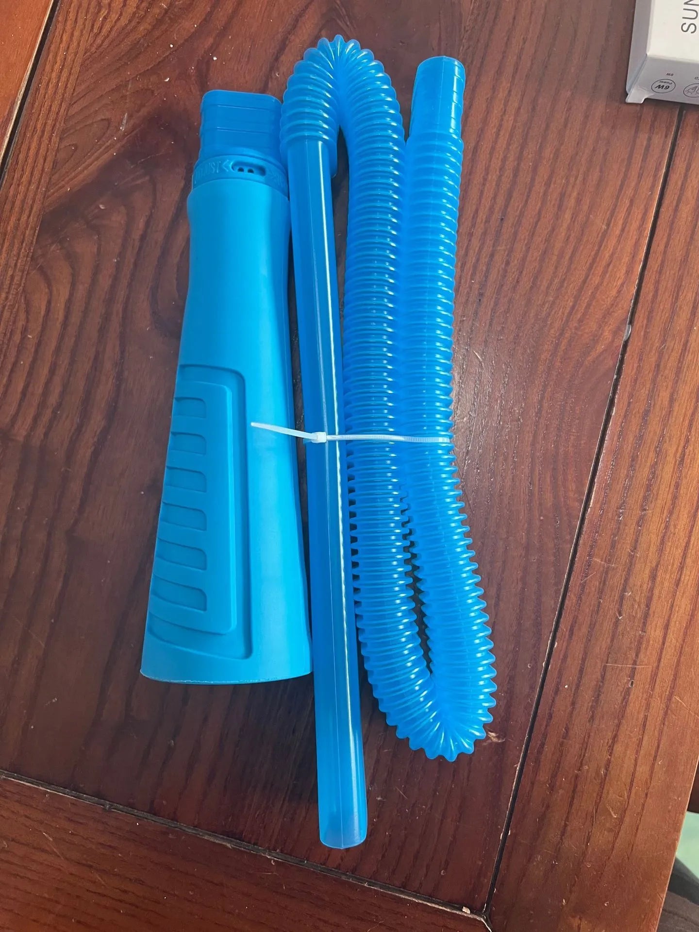 Blue washing machine dust cleaner with 114cm flexible suction pipe and round plastic head