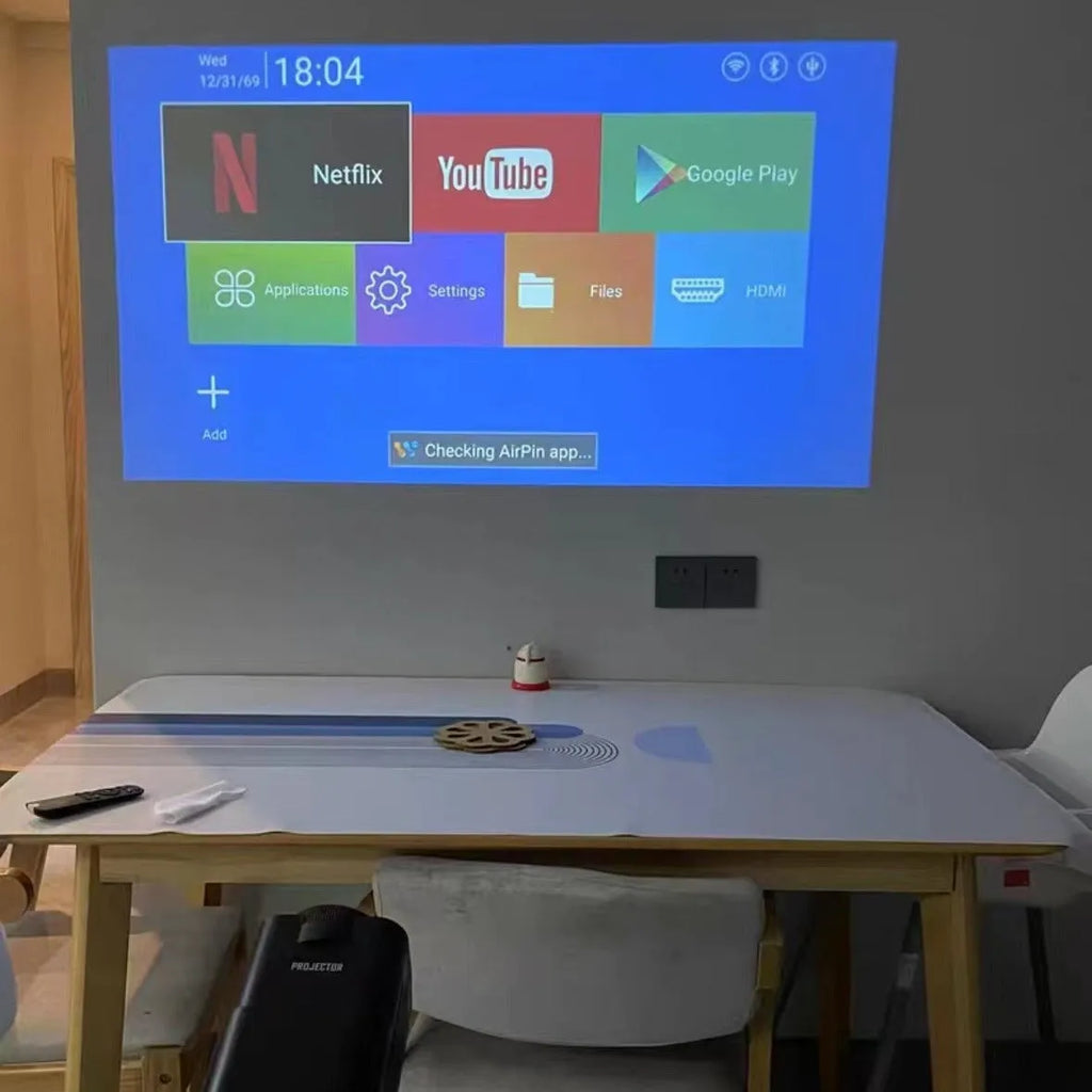 Compact wireless HD game projector with screen handle for home entertainment setup
