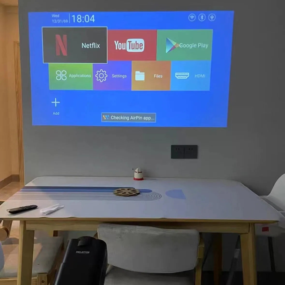 Compact wireless HD game projector with screen handle for home entertainment setup