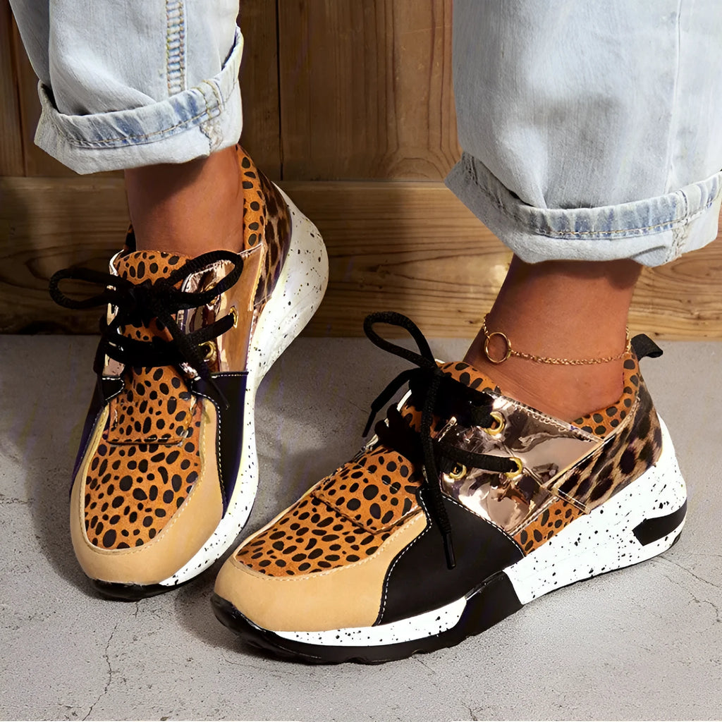 Women's black suede casual sneakers with a wedge heel on a white background