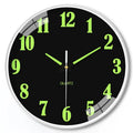 8 inch round luminous wall clock with modern plastic shell on a wall