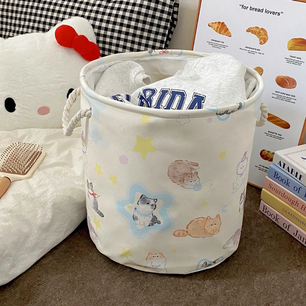Foldable cotton laundry basket in a colourful design, shown unfolded for use.