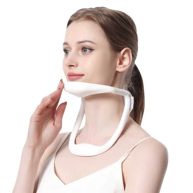 White PP plastic neck and shoulder support brace for posture correction on a grey background.