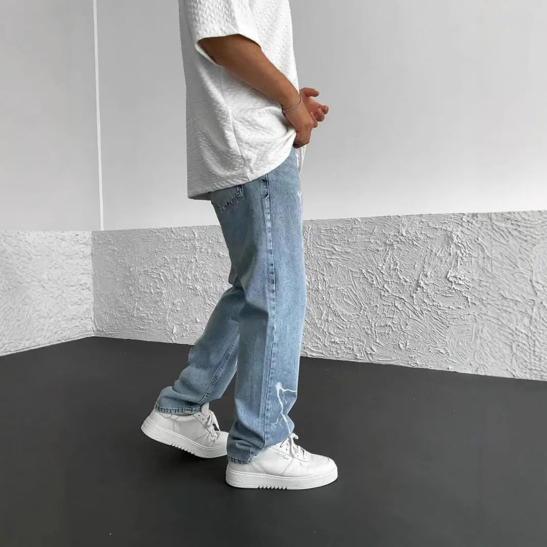 Men's blue straight-leg denim jeans with wide leg cut and mid waist design