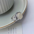 Adjustable copper vintage ring with imitation white chalcedony and antique finish