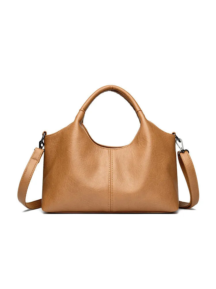 Genuine leather women's cross-body bag in black with soft texture and large capacity design