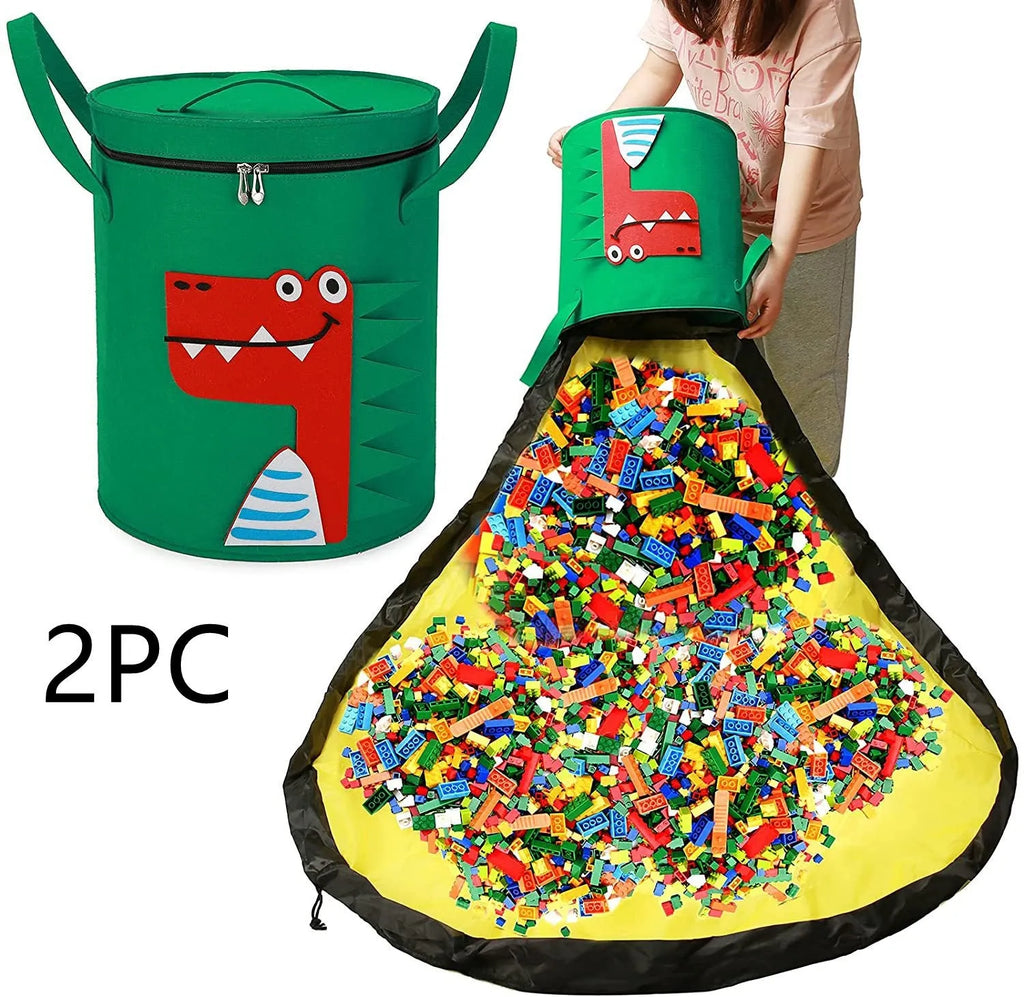 Green cube-shaped felt storage bag with pull rope lying flat as a play mat.