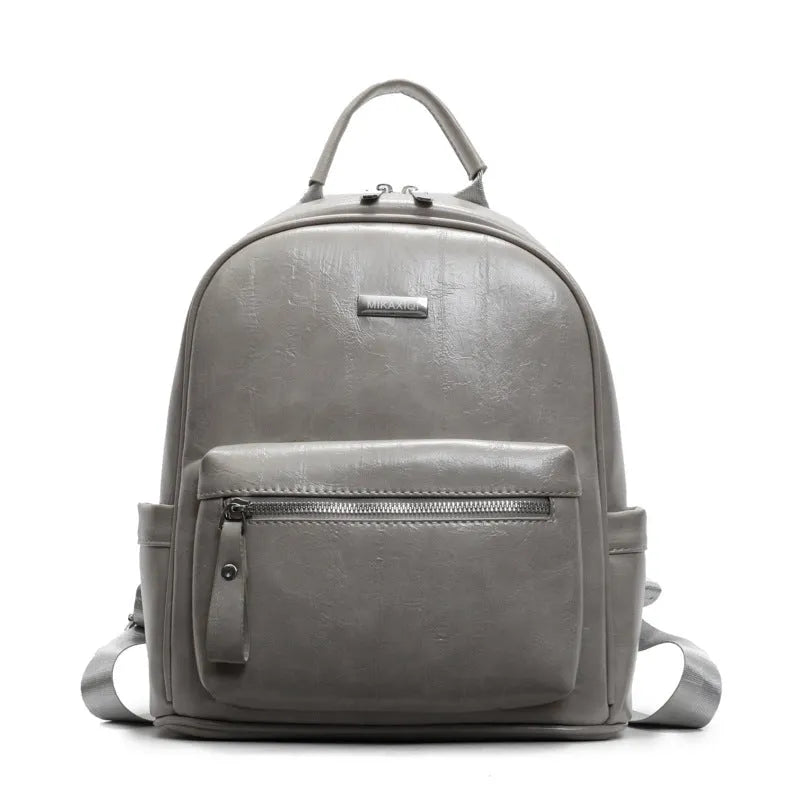 PU leather ladies travel backpack in urban simplicity style with sandwich pocket and polyester lining