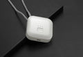 Mini USB portable air purifier necklace in pink, showing compact wearable design.