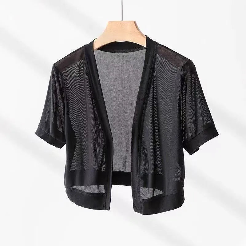Women's black long sleeve shirt with irregular French collar, front tie, and bell sleeves