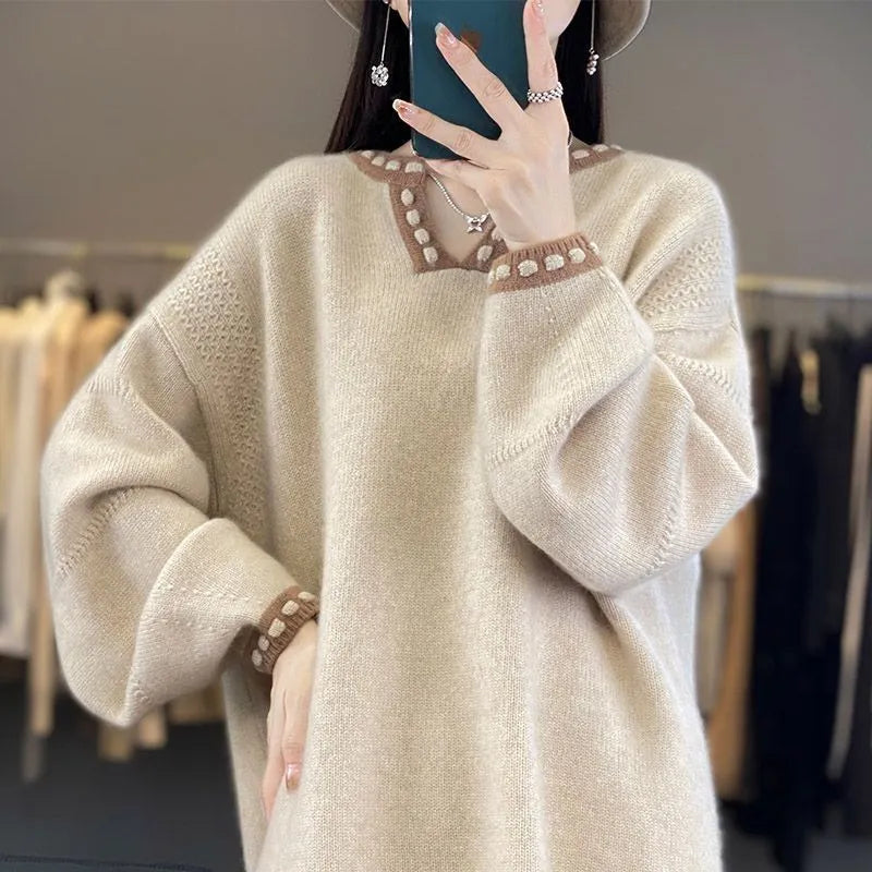 Women's camel coloured V-neck viscose sweater with long sleeves laid flat.