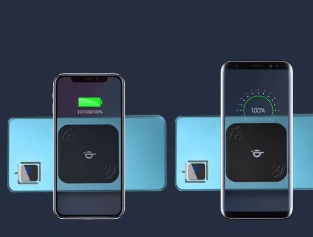 Black portable power bank with LCD display showing battery percentage, next to a smartphone for scale.