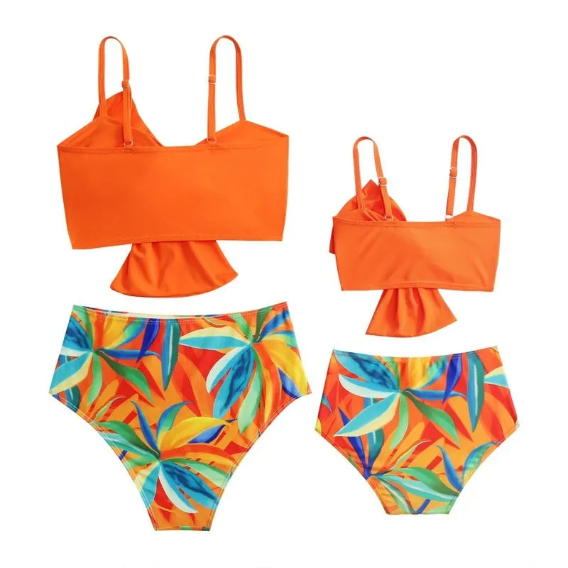 Women's big bow bikini print swim trunks set in orange with nylon fabric, front view