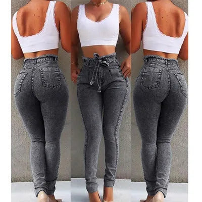 Women's fringed jeans in cowboy denim fabric showing decorative leg fringing detail