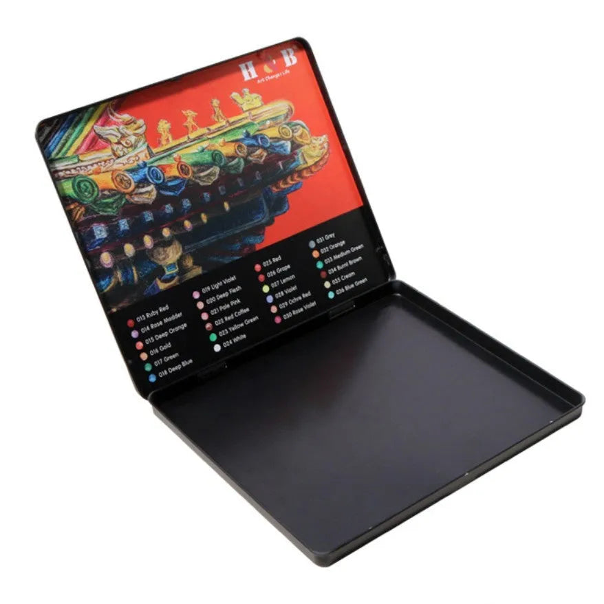 Metal tin open to show 24 water-soluble coloured pencils with brush tips.