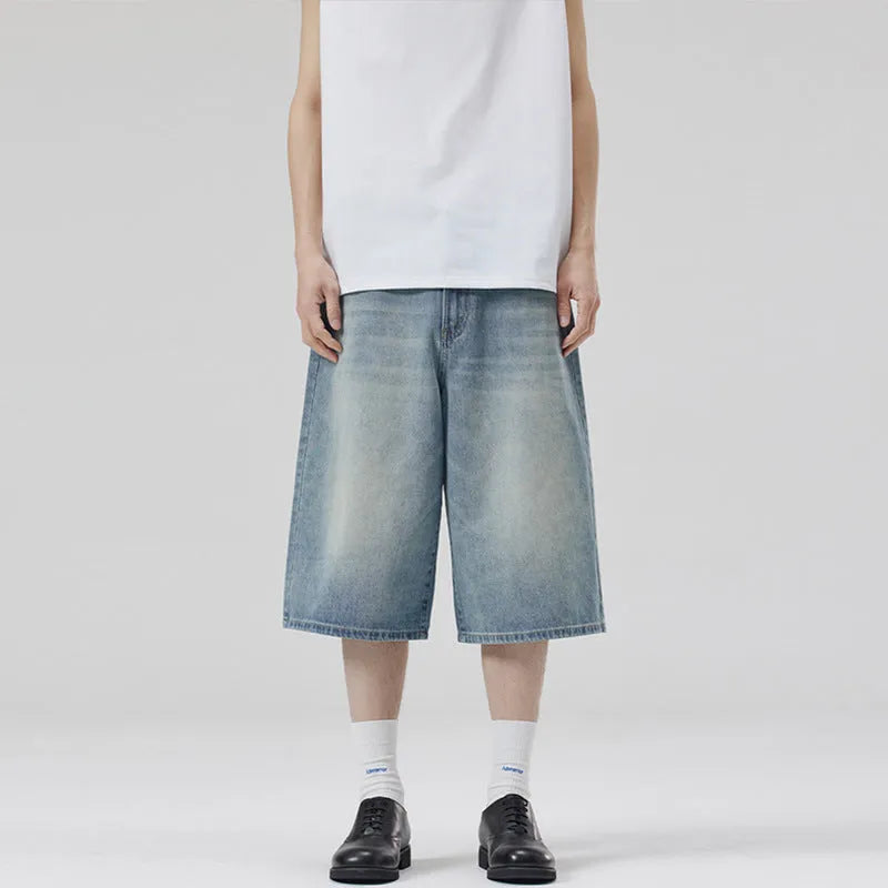 Men's loose straight-leg denim shorts in light blue on a model for summer