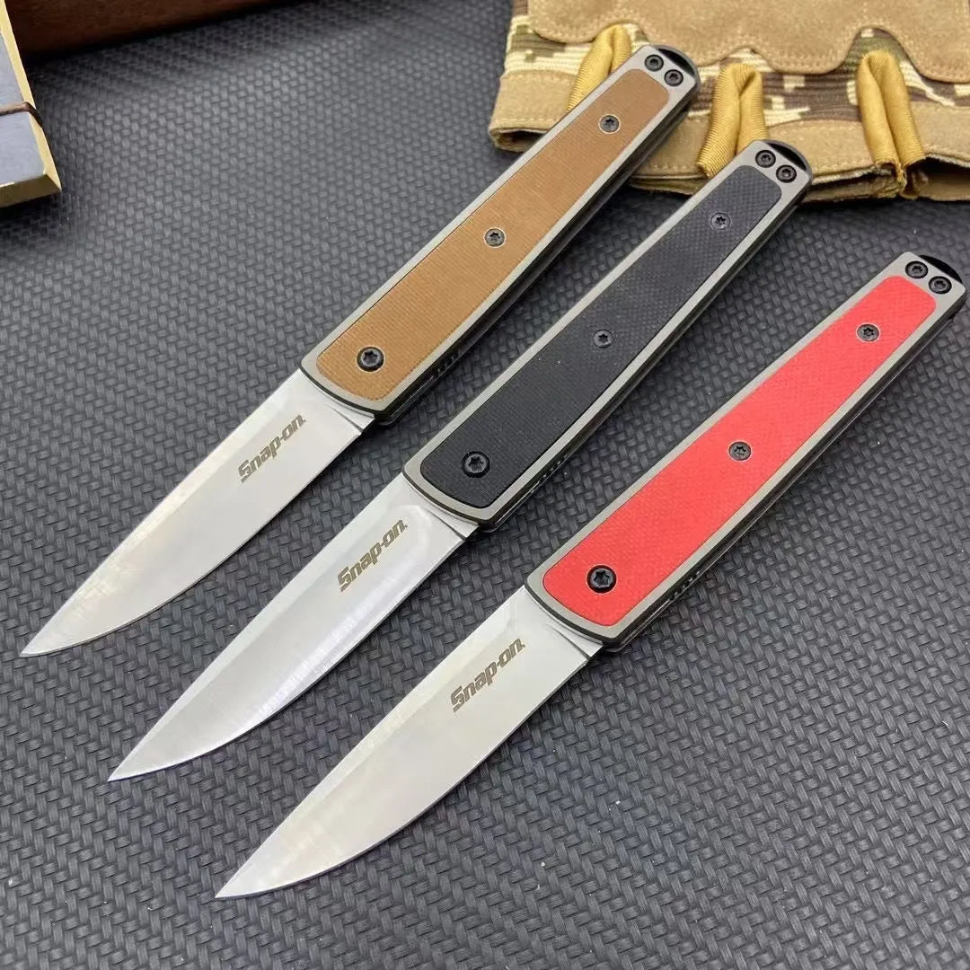 Closed and open views of a folding fruit knife with a coloured handle and stainless steel blade.