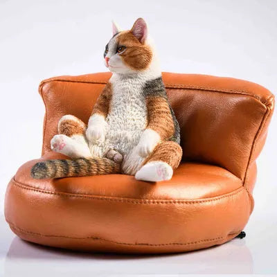 Lazy Cat resin figurine on a small sofa, a 7.5cm car dashboard ornament.