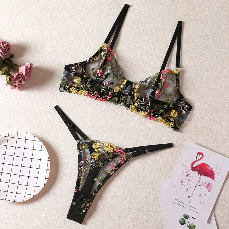 Floral patterned mesh bra with steel ring T-back in various colours on a mannequin.