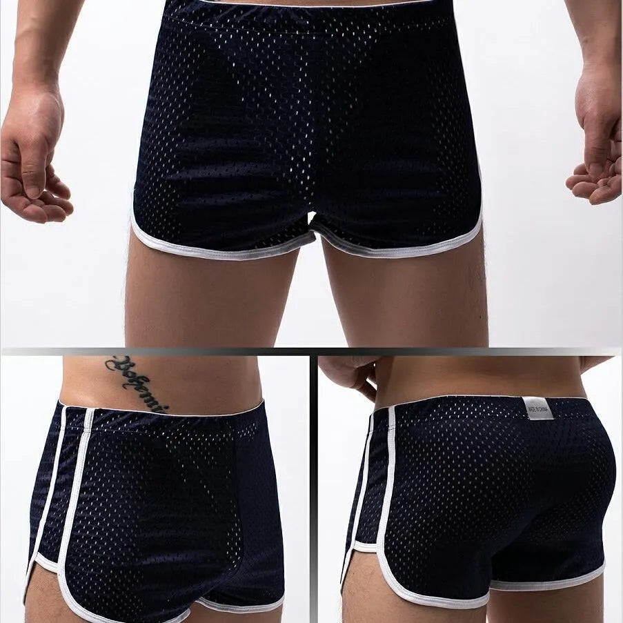 Men's black three-point boxer shorts made from a cotton and nylon blend fabric.