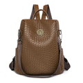 Women's black anti-theft backpack with weaving stitching detail and multiple internal compartments
