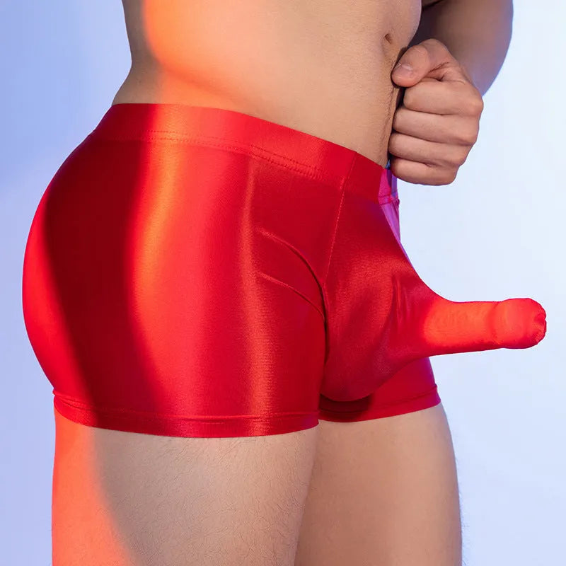 Men's red nylon elephant nose boxer shorts on a white background.