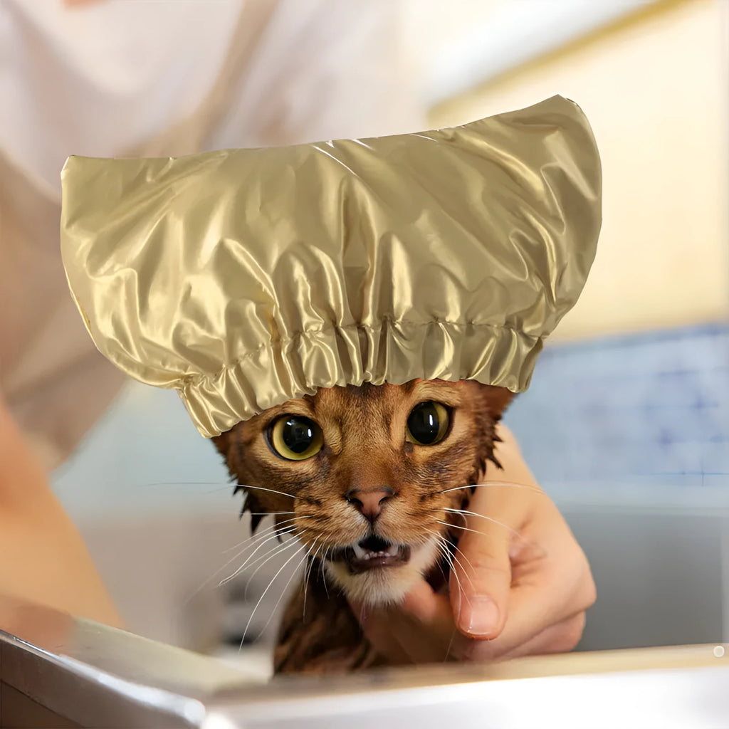A silver waterproof shower cap for dogs and cats, shown adjusted to fit over pet ears.
