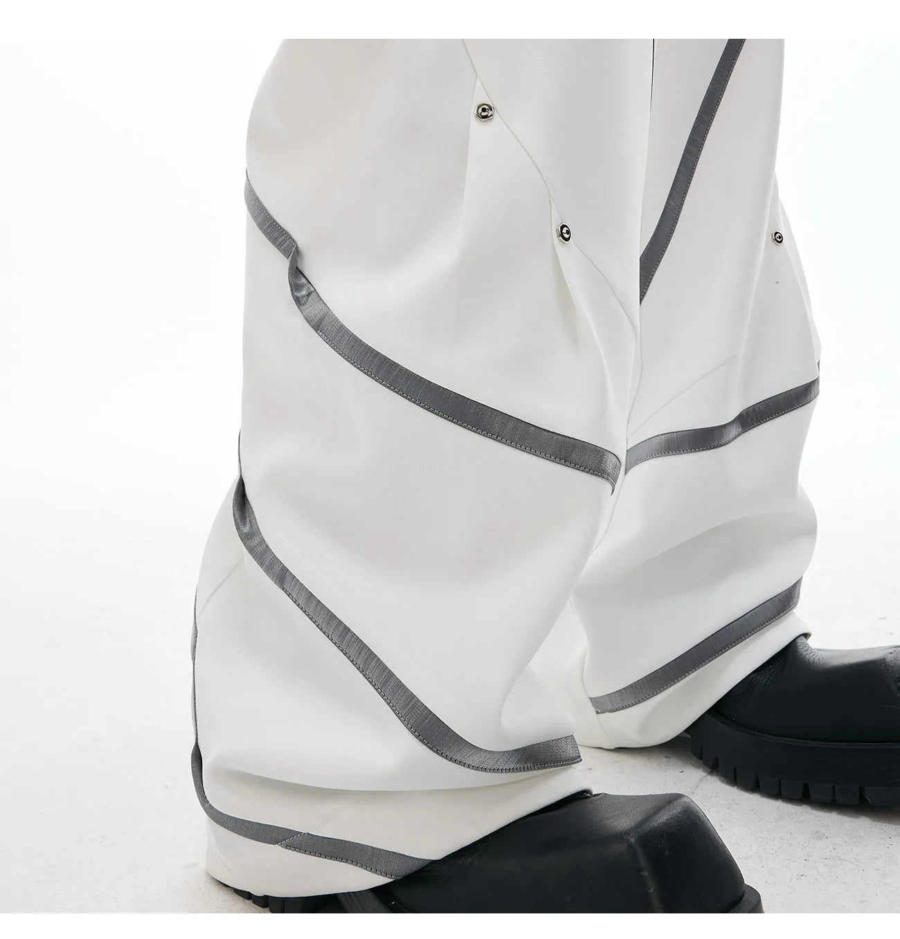 Men's black and white polyester trousers with three-dimensional cut and metal striped rivet pleats