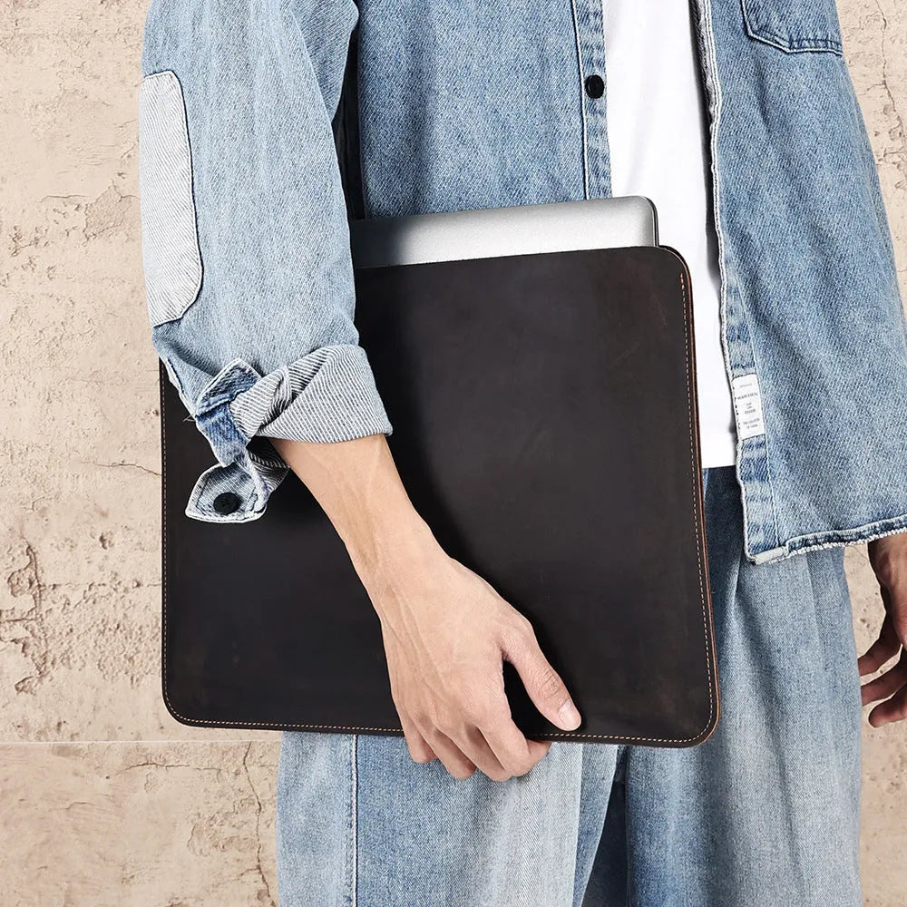 Brown Crazy Horse leather horizontal computer liner bag with a laptop inside