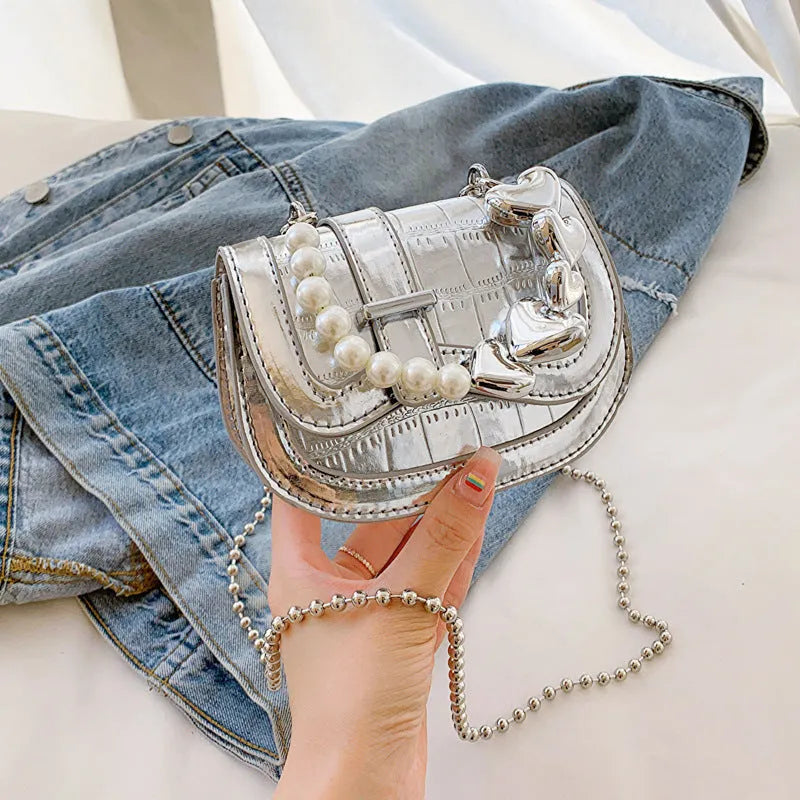 Silver PU leather mini tote saddle crossbody bag for women with a single strap.