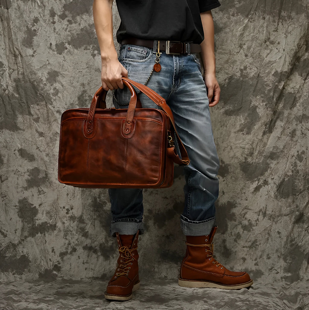 Large vintage leather men's briefcase with internal computer and camera pockets measuring 42cm wide