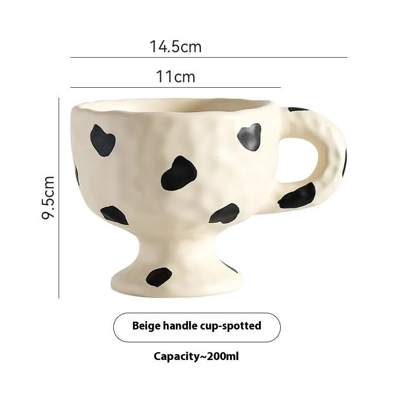 Hand-pinched irregular ceramic mug with modern minimalist design in solid colour