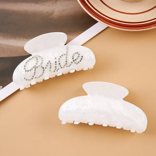 Acrylic hair barrette with sparkling diamond spot drills and English letters in pink or white.