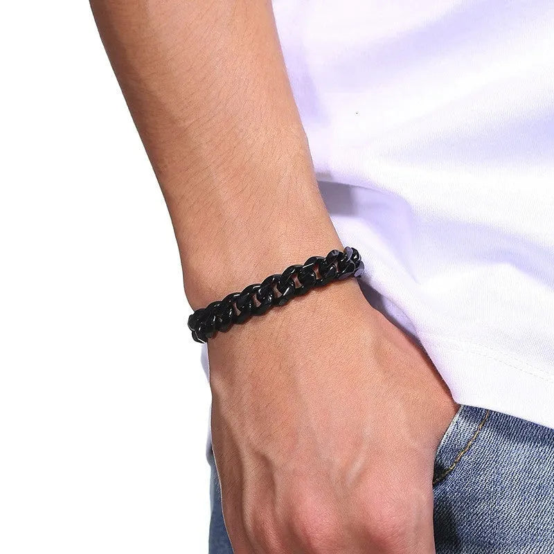 Six-sided geometric Cuban link metal bracelet in gold, black, and steel colour finishes.