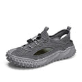 Men's black hollow sports sandals with leather mesh upper, rubber sole, and elastic band closure