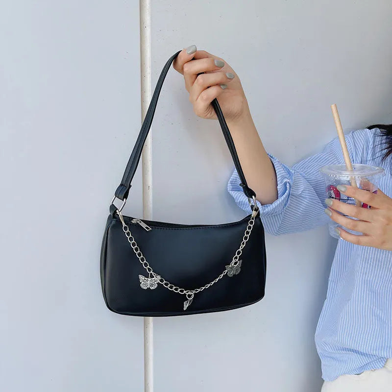 PU leather retro chain underarm bag in horizontal square shape showing crossbody strap and organised interior.