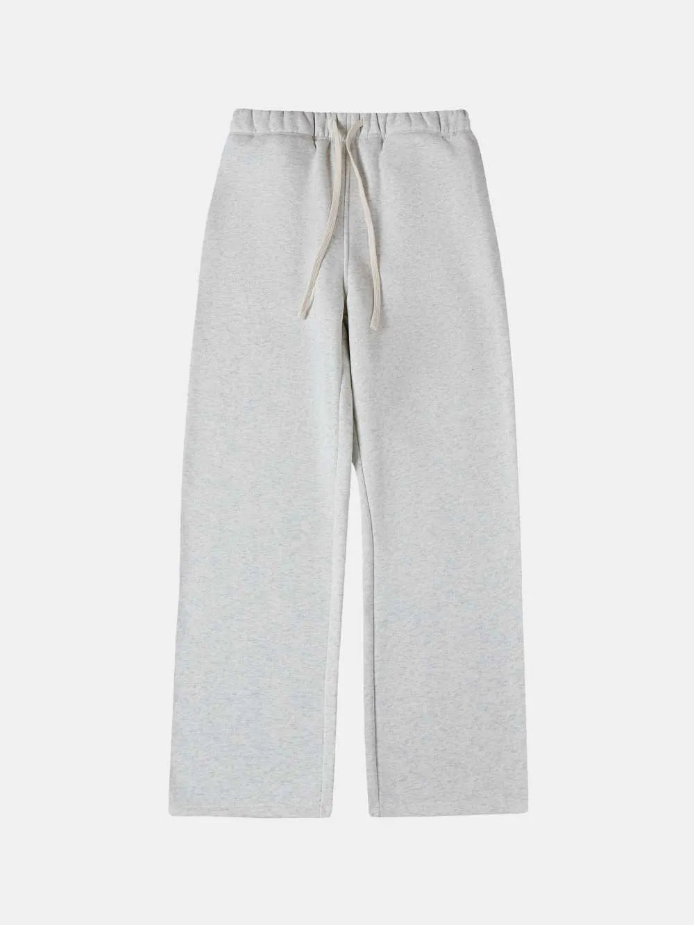 Man wearing black fleece-lined loose-fit sweatpants with an elastic drawstring waist