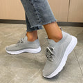 Women's mesh running shoes in Creamy White colour with Flyknit upper and rubber sole