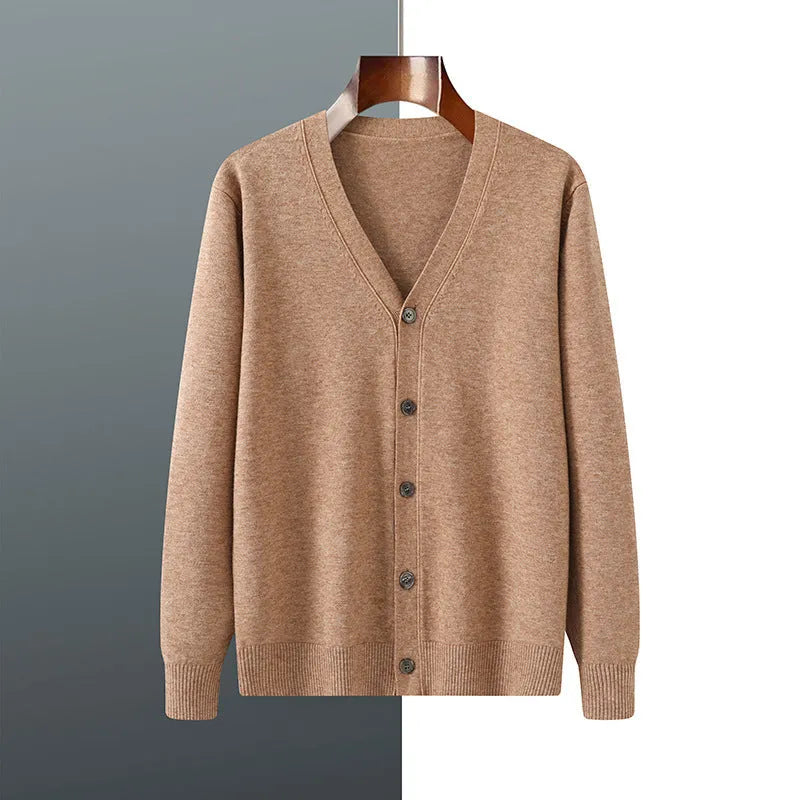 Man wearing a loose V-neck cardigan coat in Andy Velvet fabric, showing the long sleeves and available colour options.