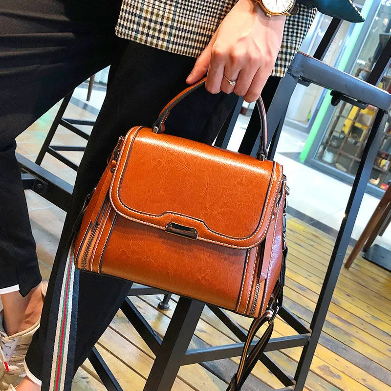 Genuine leather women's messenger bag in horizontal square shape with multiple pockets and double shoulder straps