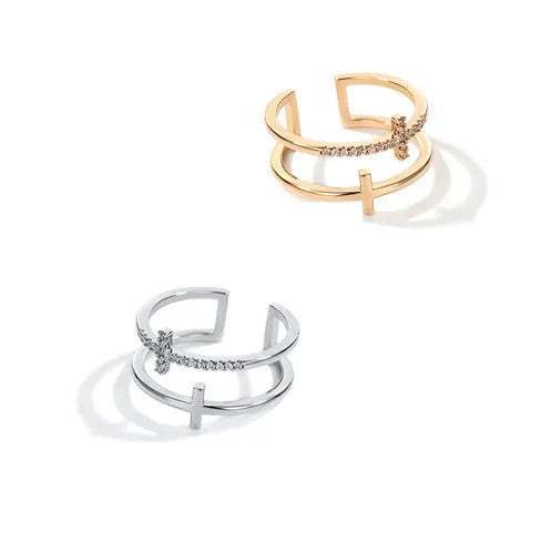 Adjustable double cross geometric ring made of copper with white gold finish and inlaid zircon stones.