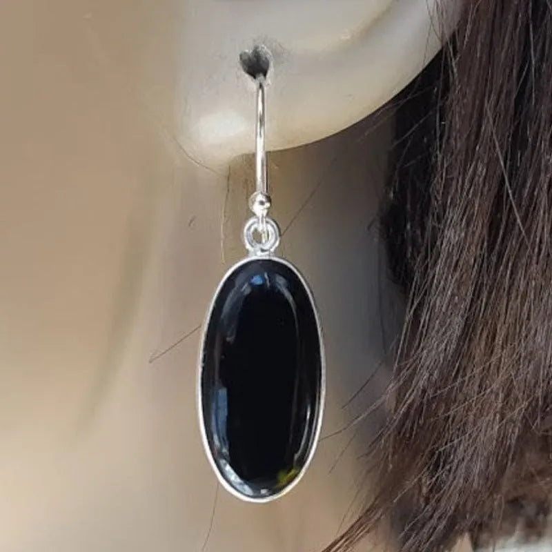 Women's earrings with oval black agate pendants on 925 silver and alloy geometric design