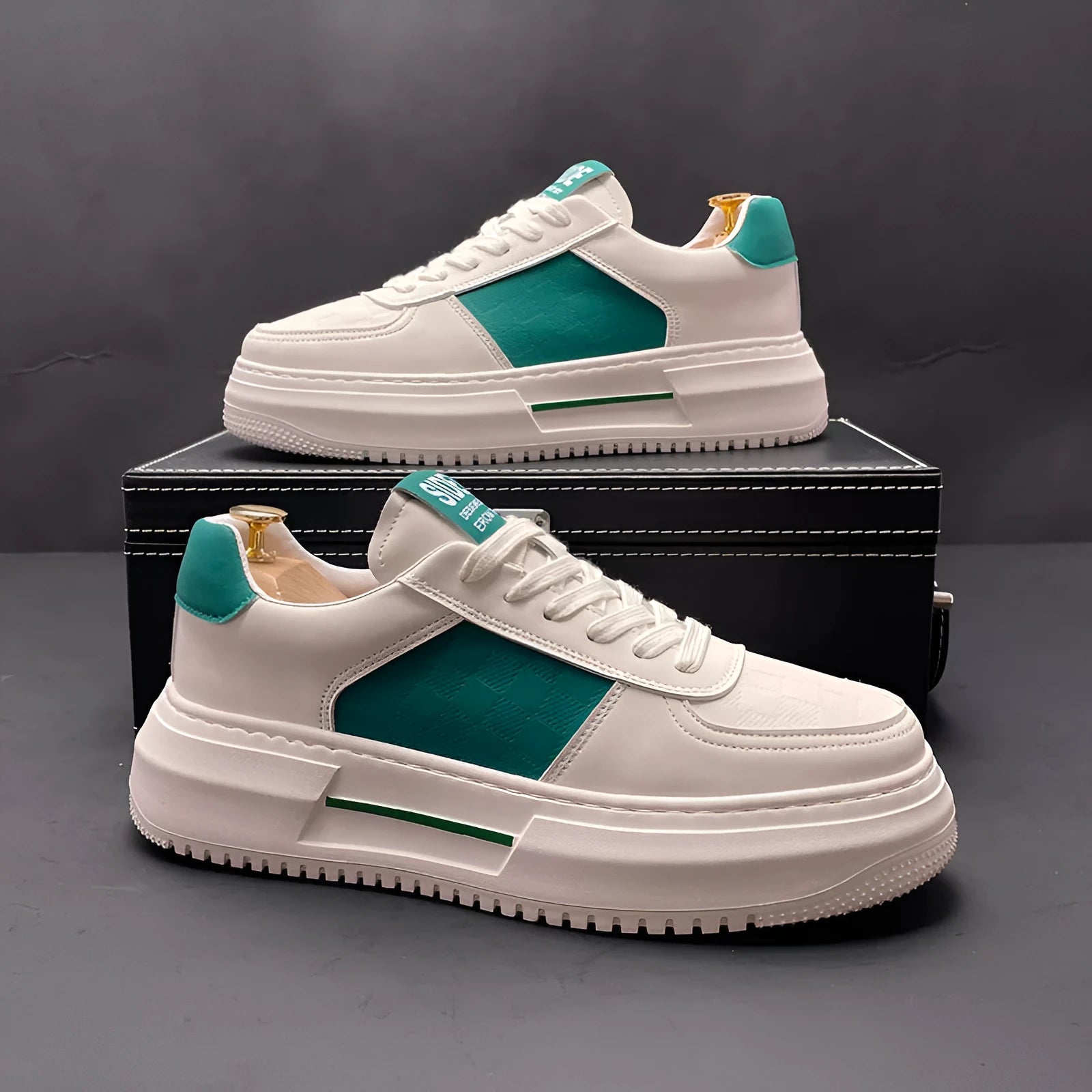 White sports casual shoes with cloth upper and rubber foam sole, available with green or black accents