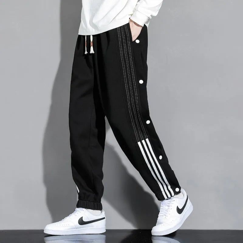 Men's loose fit cotton blend sports trousers with ankle tie fastenings and drawstring waist