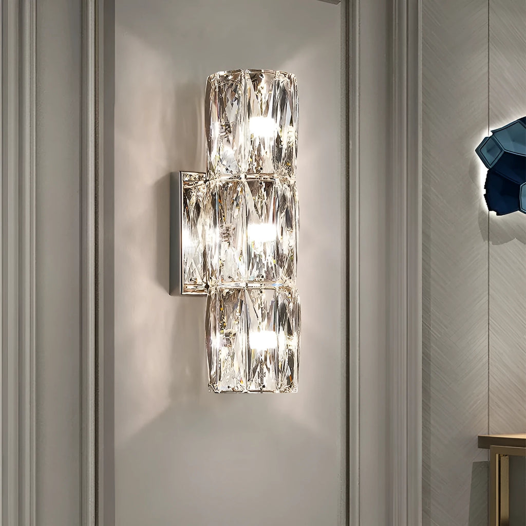 Modern crystal and stainless steel wall lamp in chrome finish with LED lighting.