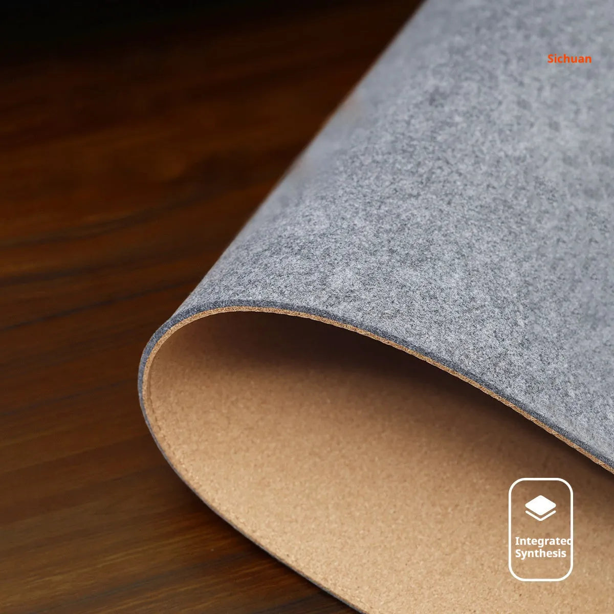 Oversized black grey felt and cork mouse mat on office desk with non-slip backing
