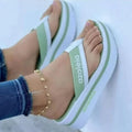 Women's platform slippers in PU with herringbone toe detail in light green colour.