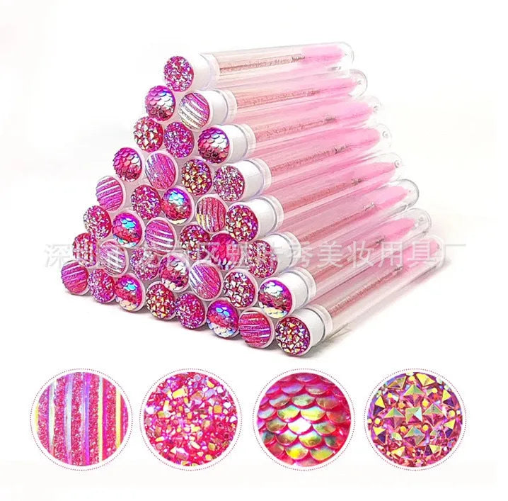 Disposable mascara brushes in protective transparent tubes with spiral brush heads in blue, green, pink, and purple colours